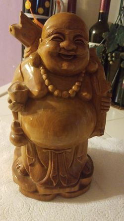 Really heavy wood budda it has no dents or any damages to it looks very nice anywhere keep it .