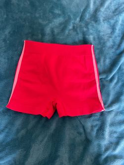Red shorts with two stripes on both sides very stretchy shorts, medium sized and very comfortable Red shorts with two stripes on both sides very stret