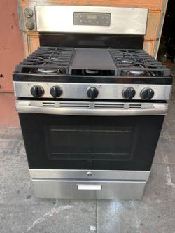 GENERAL ELECTRIC 5-BURNERS STOVE WITH GRILL, STAINLESS STEEL. FREE DELIVERY AND INSTALLATION