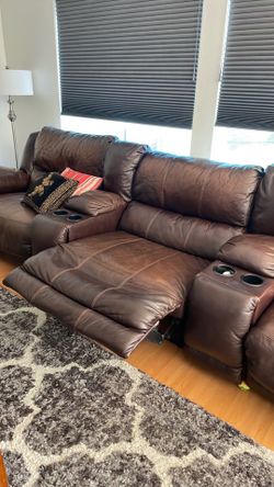 Leather Brown L-shaped sofa.
