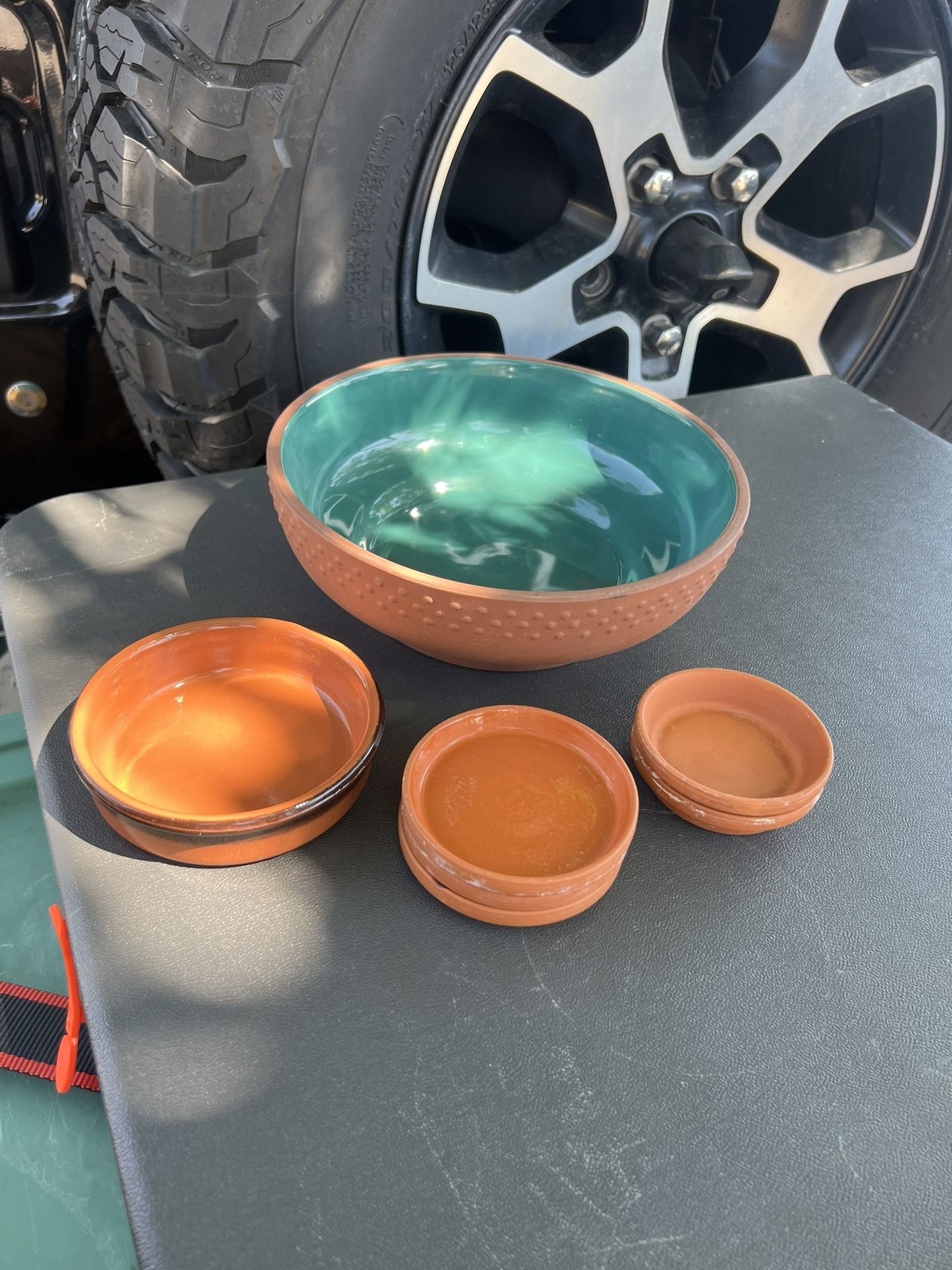 Terracotta planter and saucers