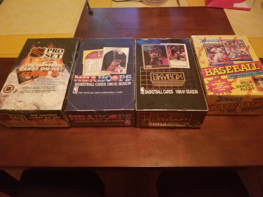 6 unopened boxes of mint condition Baseball, hockey, basketball cards