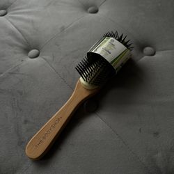 the body shop styling hairbrush made with natural bamboo