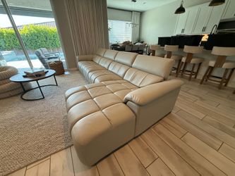 Leather powered reclining modular sectional