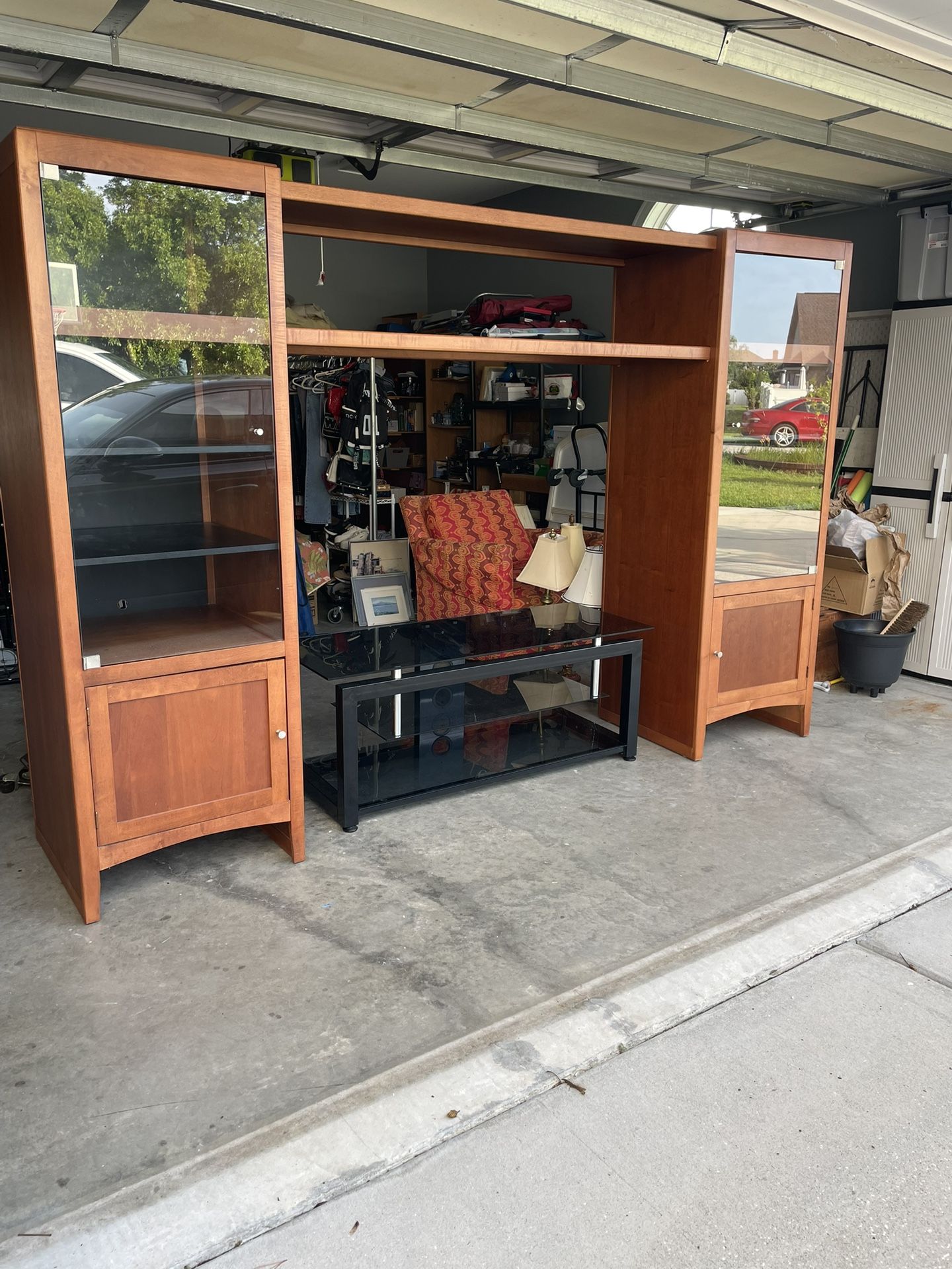 Very Solid Entertainment Center!!!! Plenty of storage. Selling with or without tv stand your choice. $225 with stand OR $175 without. Unit can expand