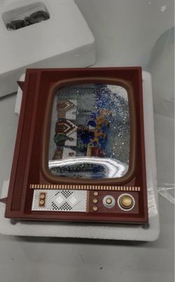 RAZ Imports (contact info removed) Santa Flying Over Town Musical Lighted Water TV Figurine