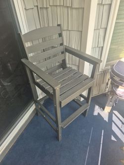 Bar height outdoor chairs with a connecting table