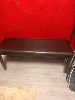 Brown leather bench
