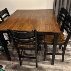 Black And Wooden Table and Chairs Set