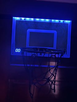 over-the-door mini basketball hoop with an electronic LED scoring display and blue lighting