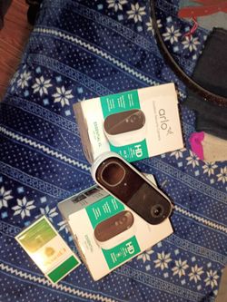 Arlo doorbell camera and 2 indoor outdoor camera