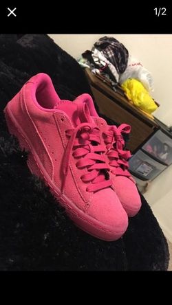 Pink suede pumas
