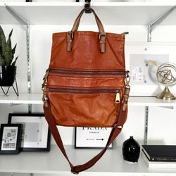 Women’s Fossil cognac leather crossbody bag. Retail $290. Large size. Big zipper pulls with gold key charm. Gorgeous bag with lots of storage compartm