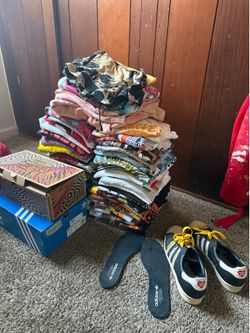 Lot of 100 tshirts plus shoes and etc