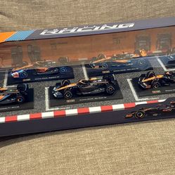 Burago 1:43 scale Ferrari and McClaren F1 cars