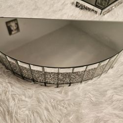 Mirrored metallic semi circle shelf
