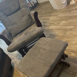 Gray rocking chair with foot rest