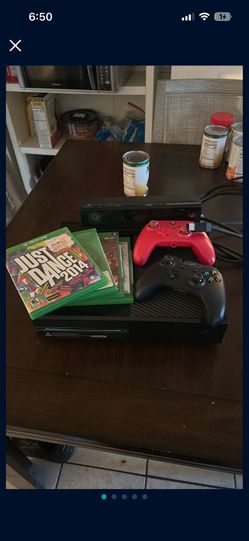 Xbox One With A Connect And Two Controllers