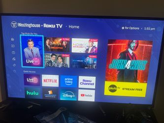 TV  Westington Roku  43 “ Smart Tv with Remote along with elegant  table and remote