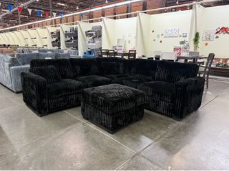 BRAND NEW BLACK FLUFFY CORDUROY SECTIONAL WI OTTOMAN