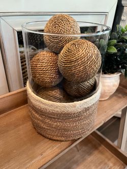 Beautiful glass cylinder with rope decor balls