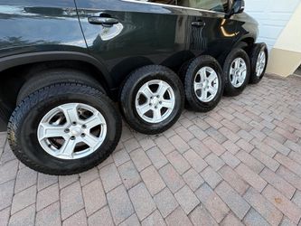 5 Jeep Wrangler rims and tires