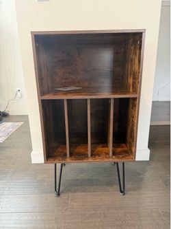 Record stand with shelves.
