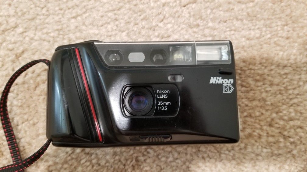 Three 35mm film point and shoot camera