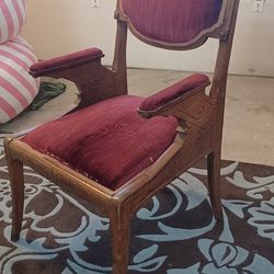 Victorian-style parlor armchair, most likely from the late 1800s to early 1900s.