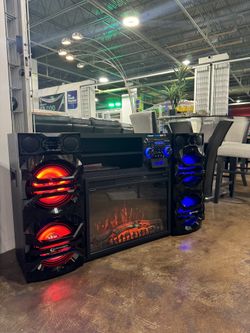 NEW speaker, tv stand and fireplace all in one. 10.000 WATTS. Bluetooth, guitar and mic in!