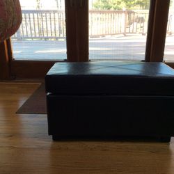 Faux leather storage ottoman