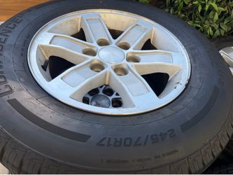 17” stock gmc sierra wheels and tires good set tires 80% tread 6 lug