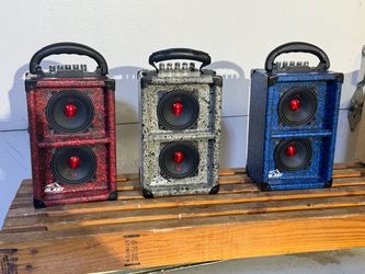 Handcrafted Bluetooth speakers with a unique design and durable textured finish.