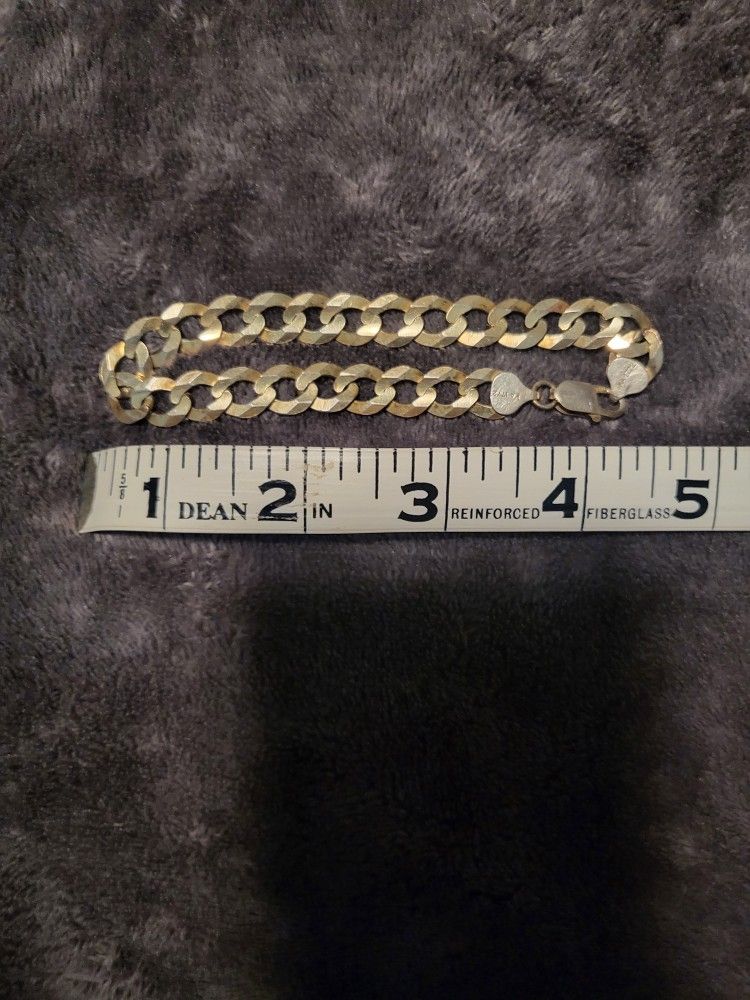 9 Inch Silver Bracelet With Gold Tone.
