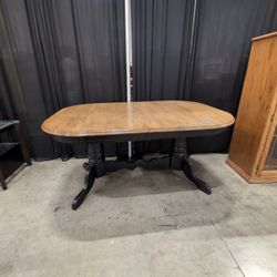 Light Wood Oval Dining Table with Dark Pedestal Base