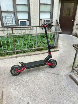 Electric scooter with key and charger