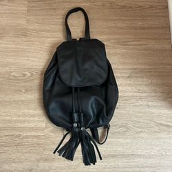 Black leather backpack with tassels