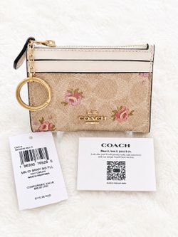NWT Coach zip card case with floral Pattern