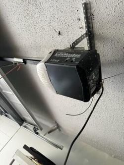 Garage Door Opener Broken Spring Off Track Adjustment Replace And Parts