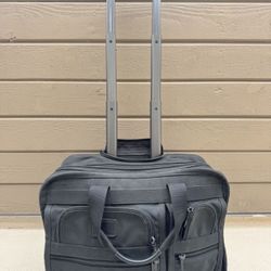 TUMI Alpha Deluxe Rolling Briefcase- Carry On 