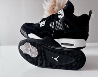 Black and white retro Jordan 4s