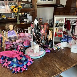 Two American Girl dolls and large lot of clothes/accessories