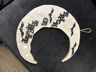 This light wood crescent moon "Trick or Treat" sign