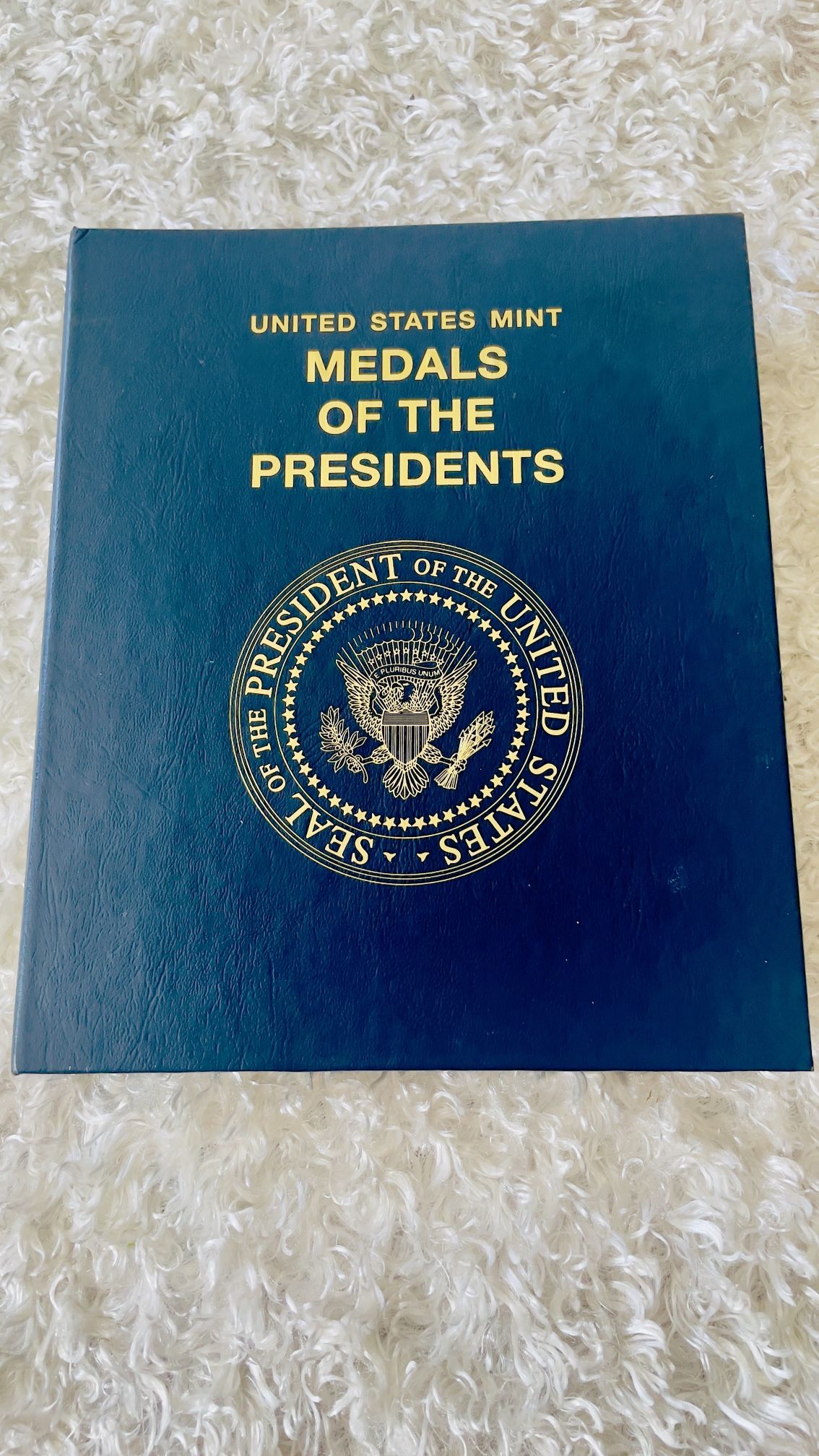 "Medals of the Presidents" collection from the United States Mint, featuring bronze medals honoring past presidents.