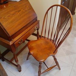 SOLID OAK DESK AND CHAIR..HAS ONE DRAW.AND A LOCKING FOLD DOWN TOP.