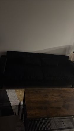 86 inch black corduroy sofa!. Only sat in once!