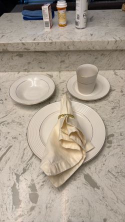 White plates with gold trim White plates with gold trim