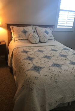 Queen size quilt, 2 shams and 2 round decorative throw pillows by JCP Home Collection.