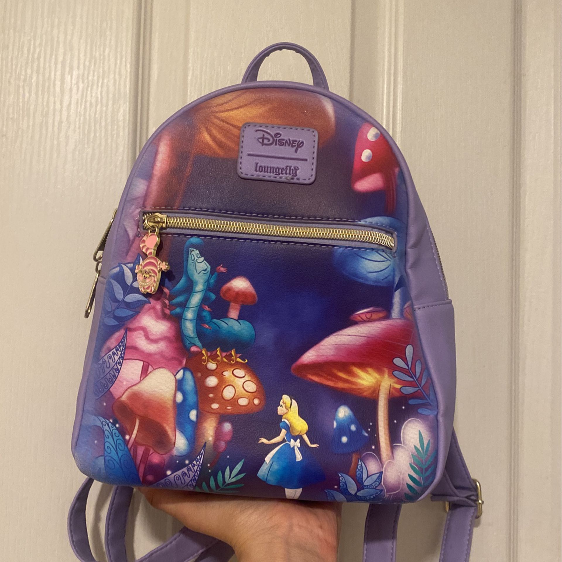 Loungefly backpack Alice in Wonderland with Cheshire Cat zipper charm 