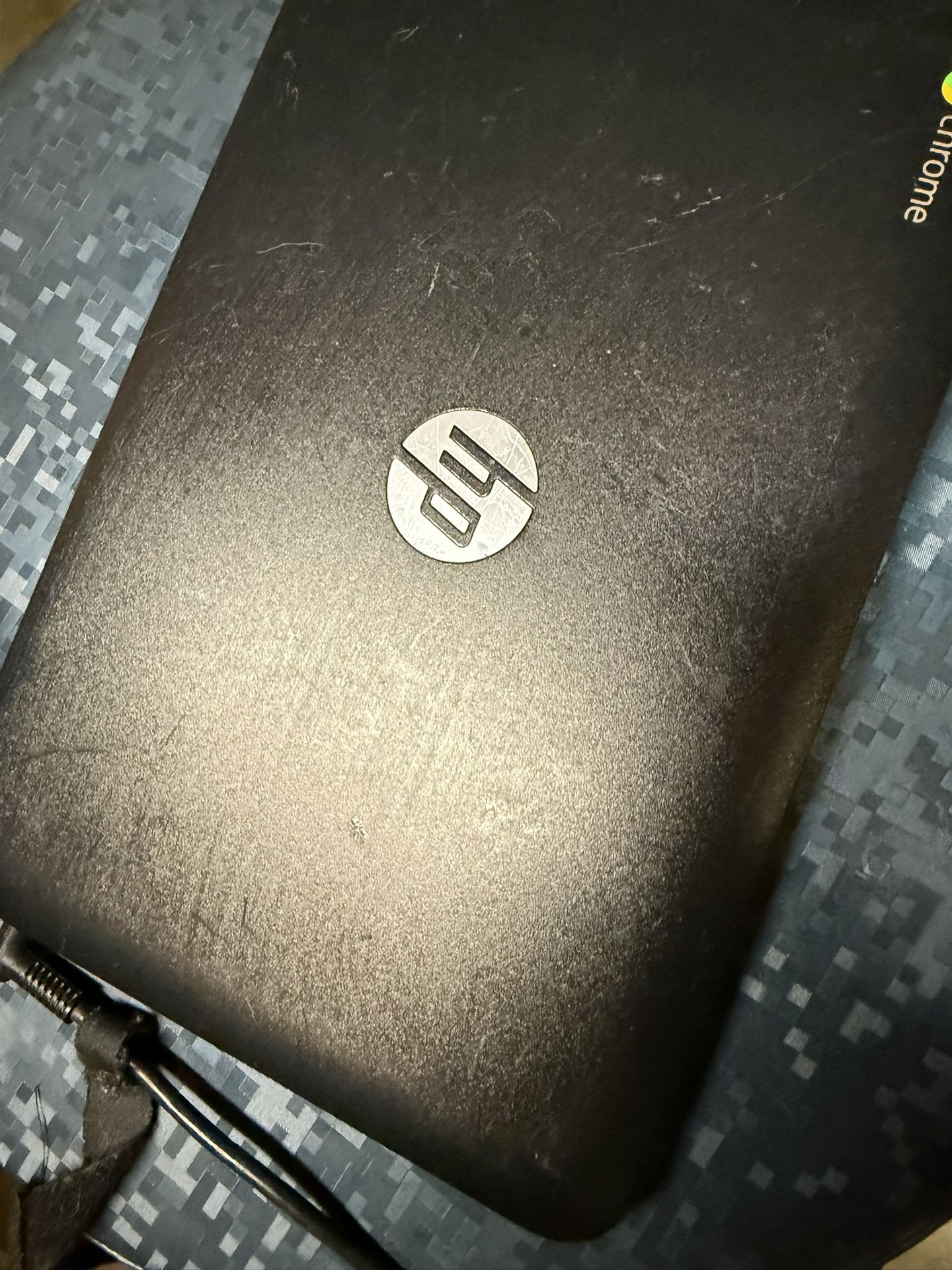 Selling this HP Chromebook with charger  Turned on as seen in the pictures